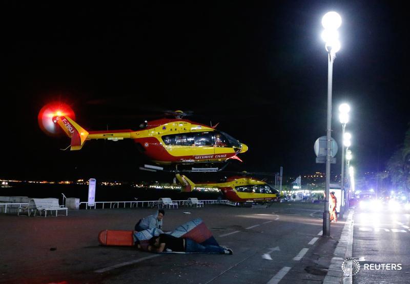 Reuters's tweet photo. 84 dead and scores injured after truck attacker ploughs into French crowd: https://t.co/1RMcbX39Ju https://t.co/H23fZtO5zK
