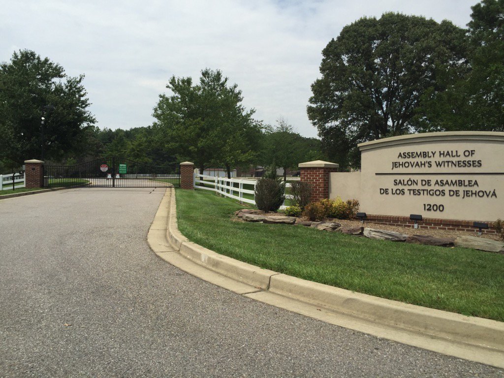 When the Jehovah's Witness church has a gate that keeps people out yet regularly go door to door in my 'hood #ironic