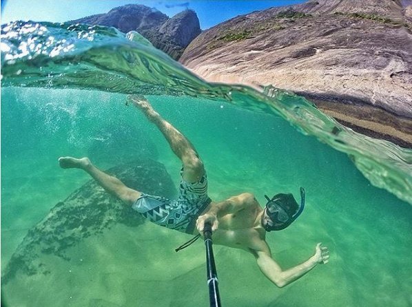 VisitBrasil's tweet photo. Surrounded by huge rocky cliffs, the green sea of Itacoatiara Beach invites you for a refreshing dip! 💦📷: @leosens https://t.co/ZqlV1ZBJFi