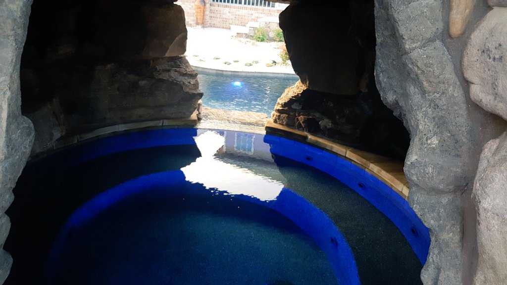 A built in hot tub in a grotto...yes, please! #hottub #poollife #grotto #takeadip #soaking