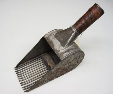 Picking huckleberries is a fun summer activity for hikers in the Northwest. This handmade picker dates to 1920.