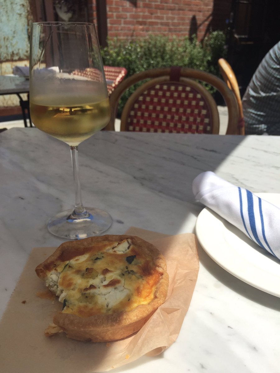 Glass of Roussane @LesMarchandsSB with a divine goat cheese quiche from #helenaavenuebakery next door is heavenly.