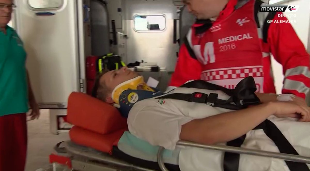 movistar_motogp's tweet photo. Bradl sale con collarín en dirección al hospital. Mucha fuerza, recupérate pronto. #GermanGP https://t.co/VachiDERpR