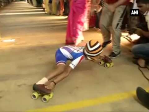 RECORD-BREAKING! 6-year old Om Swaroop Gowda registers #GuinessWorldRecord in #LimboSkating by sliding under 35 cars