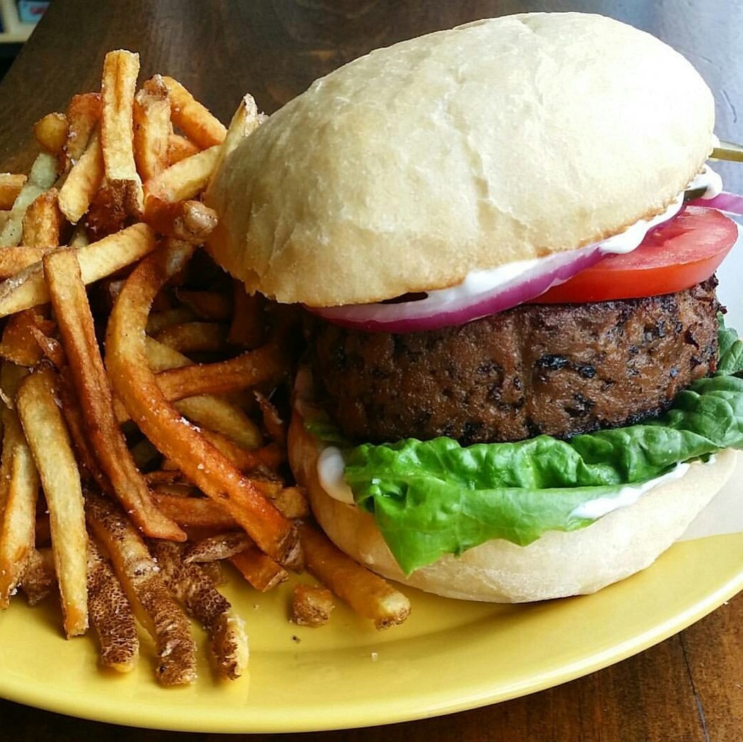 the mushroom black bean seitan burger is back today! housemade bun/side of fries/lots of juiciness. #whatveganseat