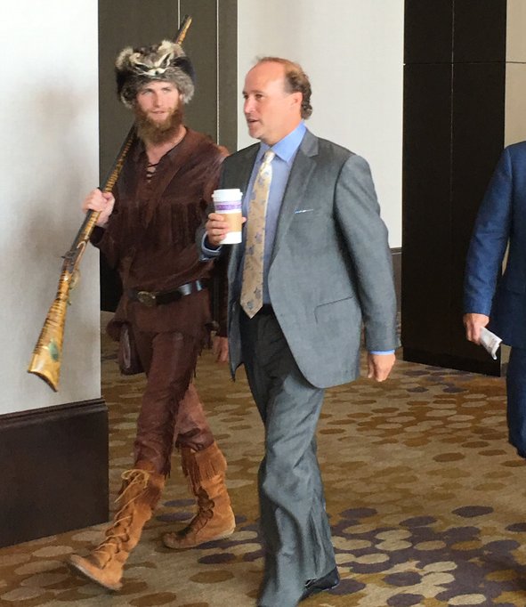 espn's tweet photo. West Virginia coaches always have the best security detail.

Watch Big 12 media days live: https://t.co/1k0UdZHNAv https://t.co/DLbULSuMxb