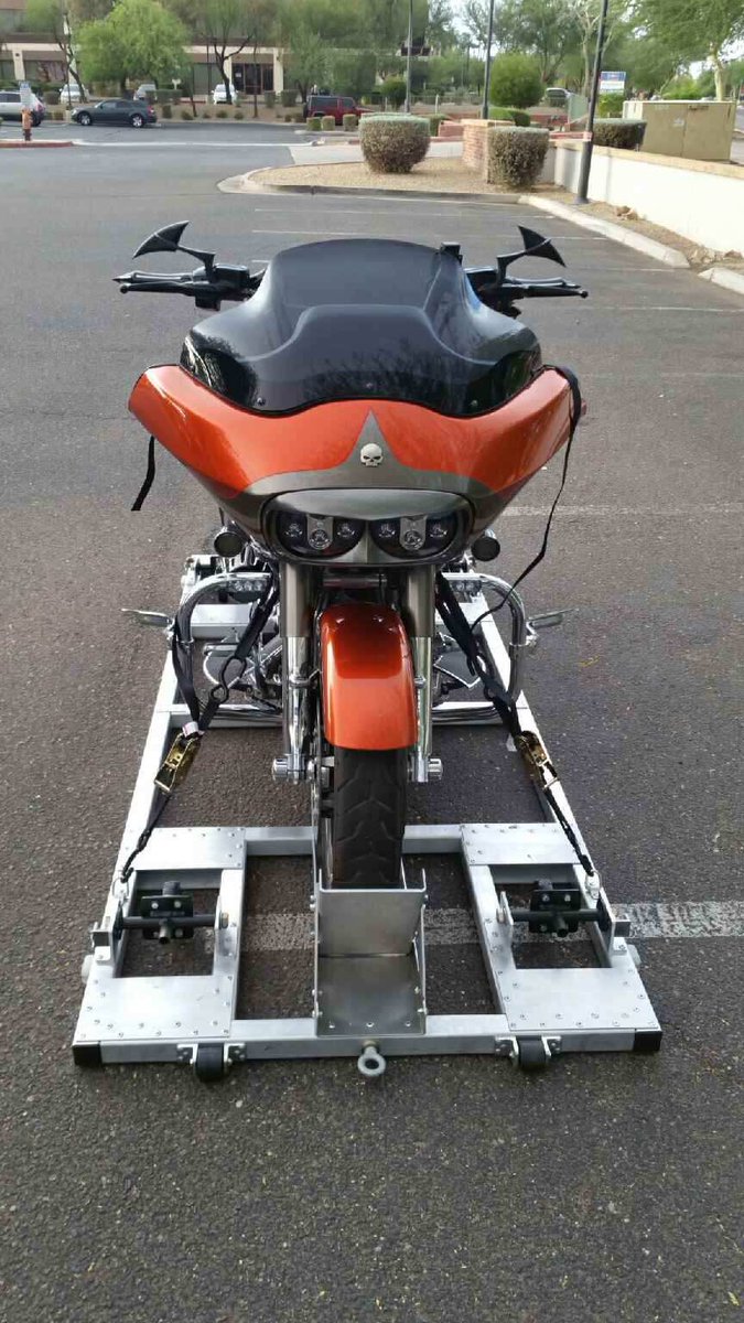 Same bike, with pallet sitting flat on the ground. Wheels can raise the pallet to make it completely portable.
