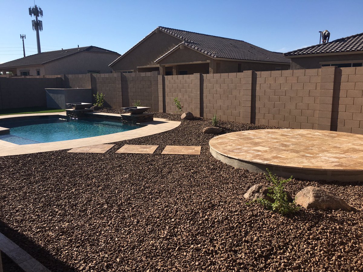 Tim_halfster's tweet photo. Completed another backyard in Gilbert Synthetic turf, travertine pavers, raised firepit pad and granite ground cover https://t.co/uf0bYOB1NM