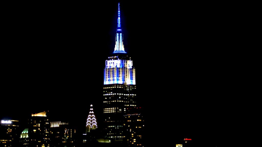 MLB's tweet photo. After the @Yankees win in #SubwaySeries Game 1, @EmpireStateBldg shines in pinstripes. https://t.co/scaDkjFgzp