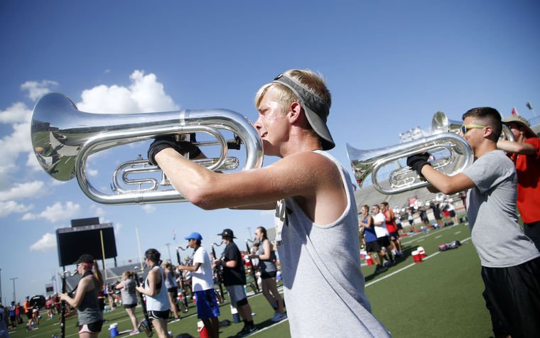 tulsaworld's tweet photo. Area high school marching bands spend summer gearing up for season https://t.co/LLgf3vs38F https://t.co/u4kDucWBcL