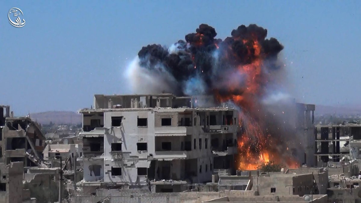 Assad helicopters drop what seems to be #napalm barrels on residential areas in #Daraya this morning, causing fires.