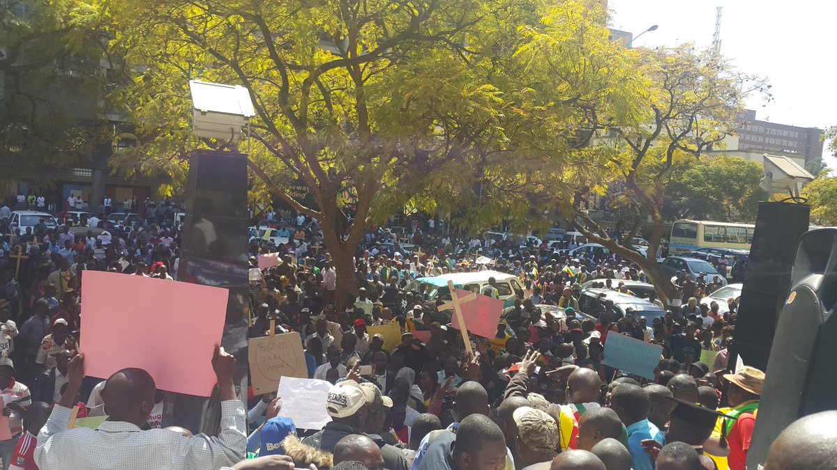 Briefarie's tweet image. Protestors  outside Finance minister Chinamasa's offces #Harare #demo #BondNotes #