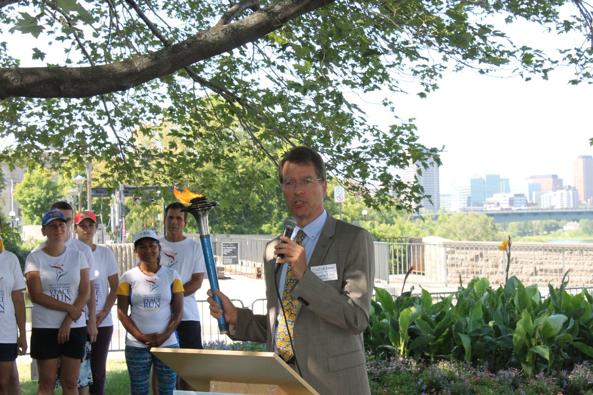 EUinCanada's tweet photo. Chargé d’affaires Manfred Auster holds #PeaceTorch on behalf of #EU, 2012 #NobelPeacePrize winner, #PeaceRun #Ottawa https://t.co/O7rpEvyGAS