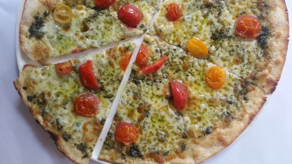 Wednesday's veggie #pizza for #happyhour - pesto and cherry tomato!