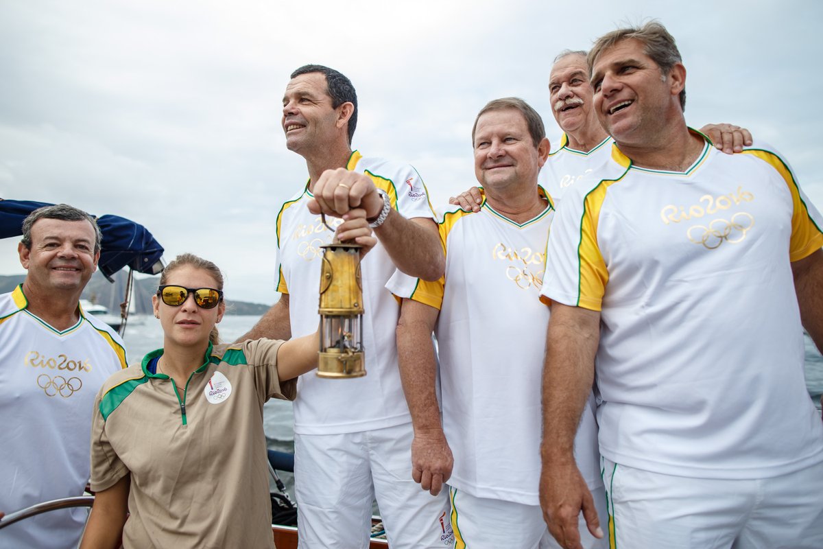 This morning the #OlympicFlame crossed from Niterói to Rio de Janeiro on a boat with 7 Olympic sailing medallists