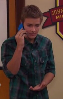 I'm talking to my beautiful girlfriend on my phone in the hallways in school cuz she's was out sick