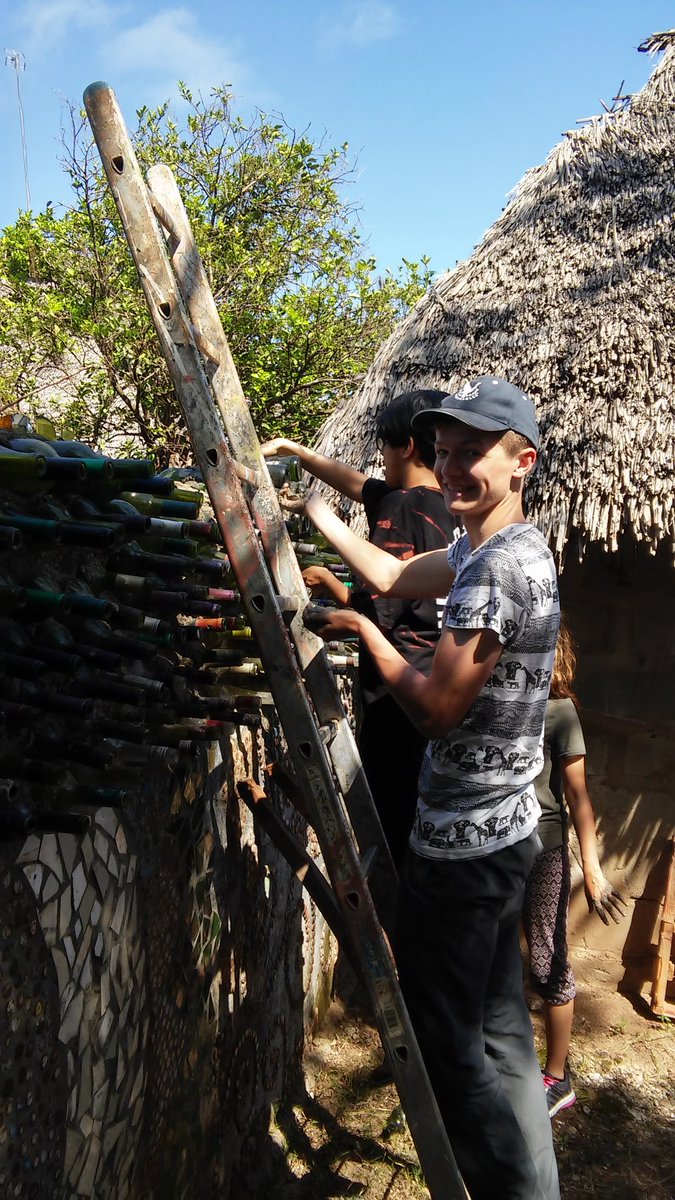 AQZanzibar's tweet photo. On day one at Creative Solutions we built a bottle wall, fused glass and cut bottles with help from Haji! https://t.co/KQ2Anj0ajd