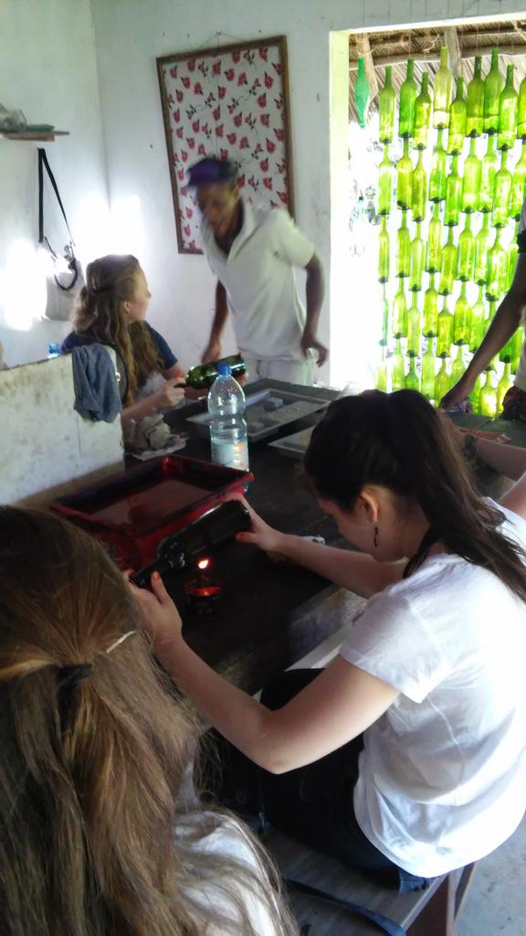 AQZanzibar's tweet photo. On day one at Creative Solutions we built a bottle wall, fused glass and cut bottles with help from Haji! https://t.co/KQ2Anj0ajd