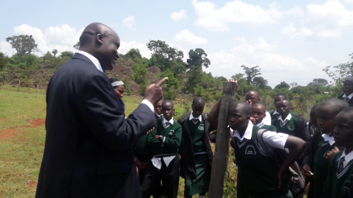 At chepkiit waterfal discussing environmental issues with students from segero sec school.