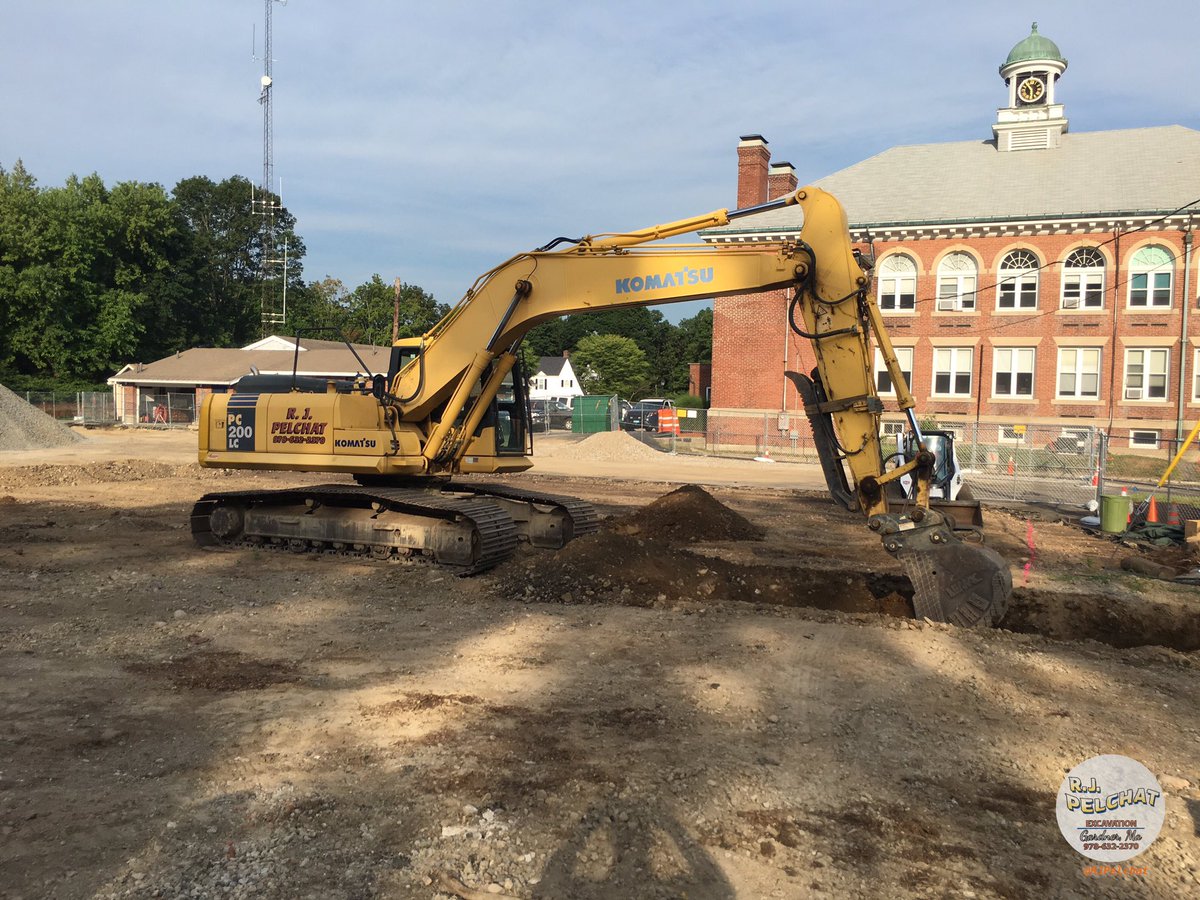 RJPelchat's tweet photo. After a lot of planning, and another long week, first bucket in the ground for the new @WestwoodPD Hqtrs! https://t.co/FtnDxQFbea