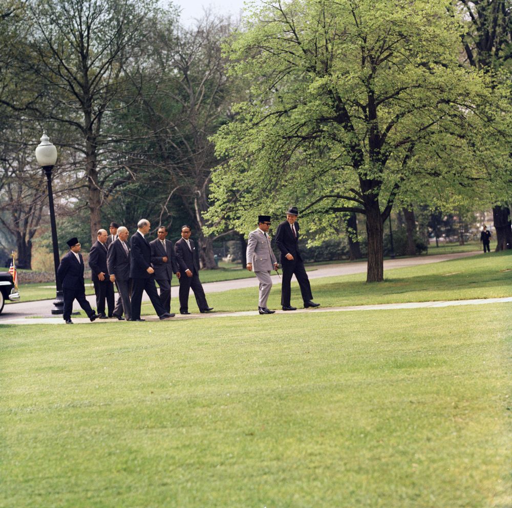 JFKLibraryFdn's tweet photo. A rare find for #haturday: JFK wearing a hat! Here he's with Indonesian President Ahmed Sukarno at the White House. https://t.co/UUQsk4YZrv