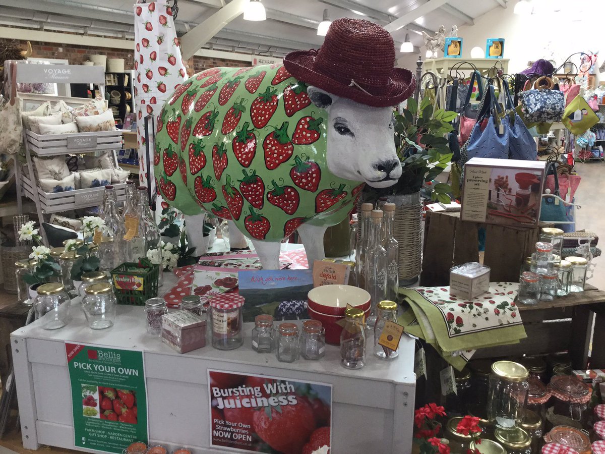 Belle our <a href="/WrexhamSheep/">The Wrexham Sheep</a> has re-located somewhere a little cooler. She is now in our Gift Department. Like the hat?