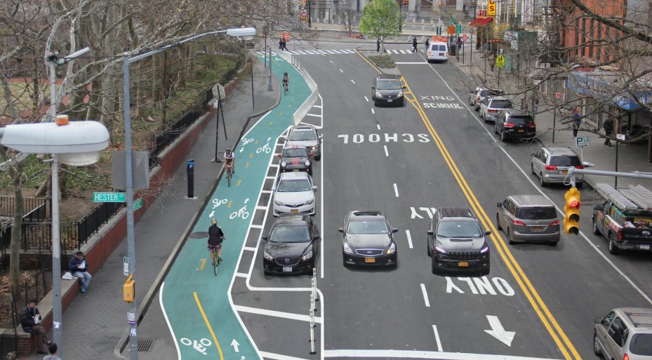 We can have separated bike lanes AND curbside parking. There's better things in life than cars speeding down Main St
