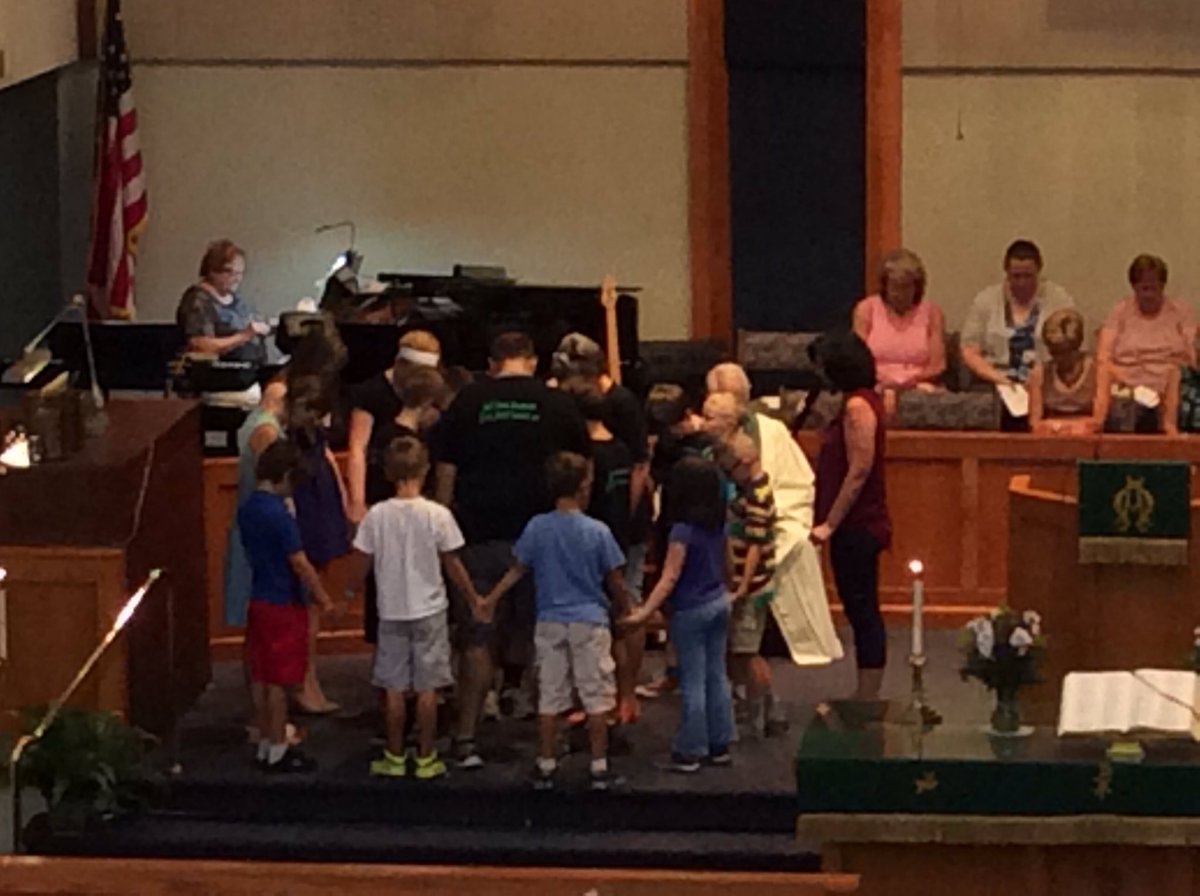 The children prayed around our youth missionaries as they leave this morning.