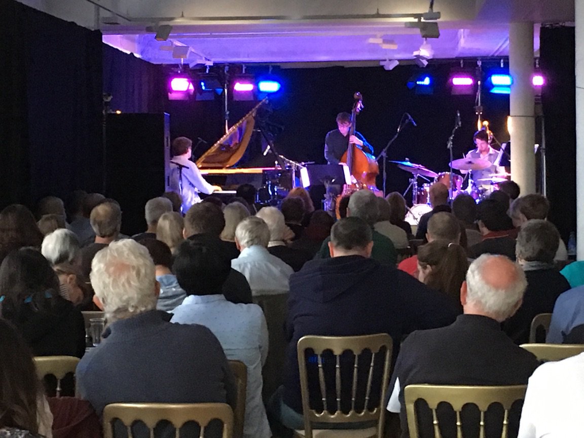EdinburghJazz's tweet photo. It might be a rainy Sunday but Fergus McCreadie Trio has a full house! #edjazzfest https://t.co/LqrfcJzSDg