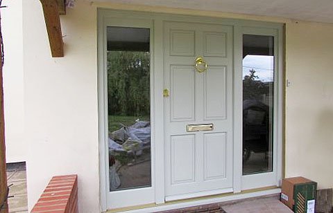 Welcome... fantastic Paxtons Timber entrance door with glazed side lights ready to greet visitors for years to come.