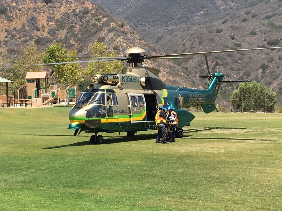 MalibuVOP's tweet photo. LASD Air Rescue 5 airlifting injured motorcyclist at Trancas Park in Malibu. #SEBLASD #LASD #LASDHQ https://t.co/XOSxWCDmpL