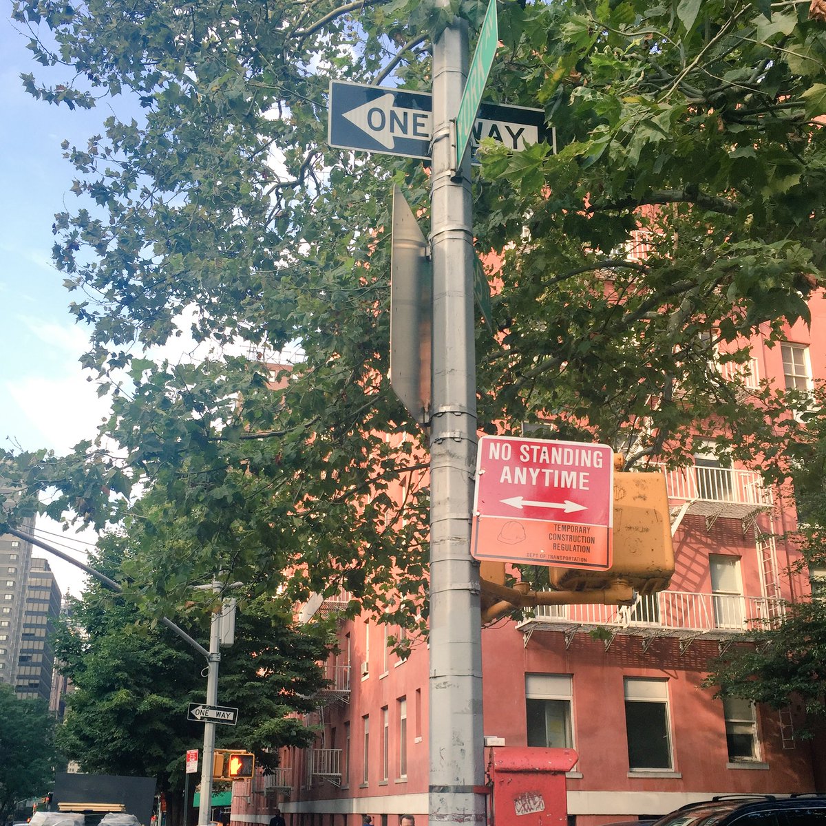 kmmxny's tweet photo. When the "No standing" sign is pointing up the Street, it actually MEANS that you can't park on the Avenue. Duh. https://t.co/rER4HGF2V9