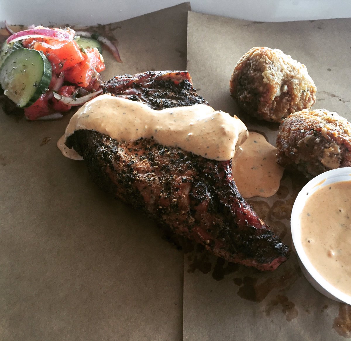 StilesSwitchBBQ's tweet photo. Fat Tuesday: Smoked Bone in Pork Chop w our Brisket Remoulade sauce served with fried Boudin Balls. #Austin #BBQ https://t.co/FvJOiigbM8