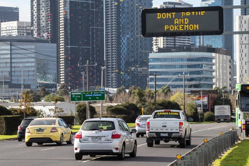 Footscray Road Sign heading into city urging drivers not to "drive and Pokemon" Photo Jason South <a href="/southey70/">Jason South</a> <a href="/theage/">The Age</a>