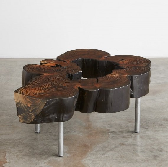 Blackened cedar flare coffee table with natural void. Buy online or visit the Sea showroom. bit.ly/2arpiDr