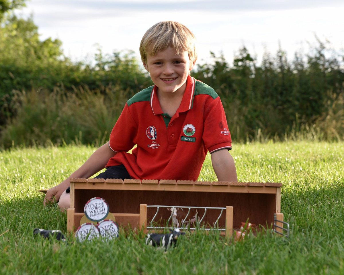 NFUCymru's tweet photo. This little farmer wants everyone to #BackWelshFarming.Just look at his farm set up! #StickerSpotter #NextGeneration https://t.co/eVIoJrR9kO