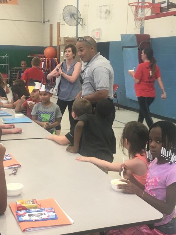 Ptl. Romero &amp; Sierosinski got to cool off for a little bit at Loudenslager Elementary during an ice cream party!