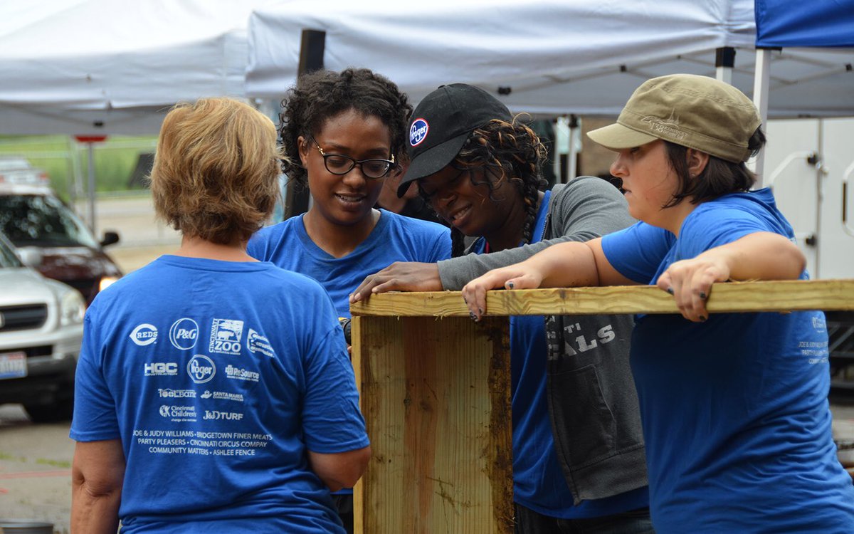 Reds's tweet photo. The 2016 #Reds, P&G, and Cincinnati Zoo Community Makeover is underway in Lower Price Hill. #makeover2016 https://t.co/9ia160malH