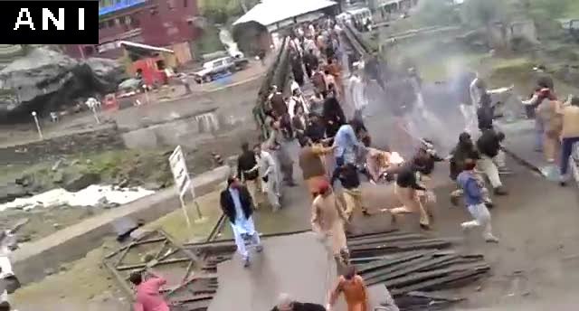 ANI's tweet photo. Angry over rigged PoK elections, locals burnt Pakistani flag in Neelum Valley (PoK) and faced police action. https://t.co/TYqVZgnzQD