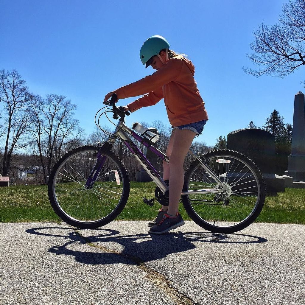 Imagn8v's tweet photo. Liv riding her bike in the cemetery. #bikeriding #bluesky #cemetery https://t.co/Rhb1Y1DlRd https://t.co/zGftuJlK2x