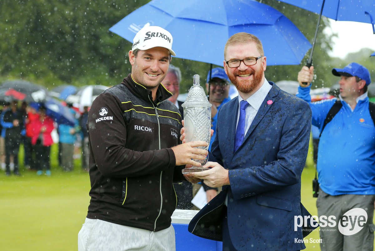 presseyephoto's tweet photo. Minister for the Economy @SimonHamilton presents winner Ryan Fox from New Zealand with the #NIOpen2016 trophy https://t.co/xKSHgfjWzU