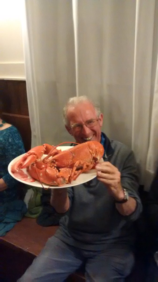 The winner of the 'Guess the Lobster weight' competition on Saturday night, with his prize! #iona #seafood #lobster