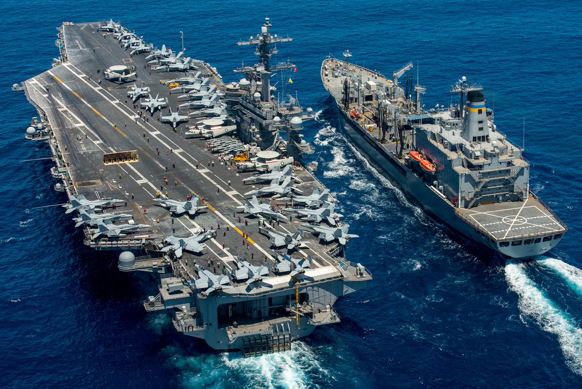 Aircraft carrier #USSCarlVinson (CVN 70) conducts a replenishment-at-sea with the #USNSYukon.