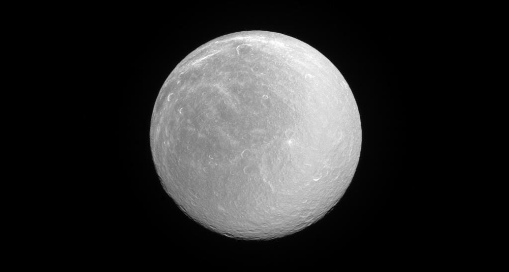 NASA's tweet photo. Saturn's moon Rhea appears dazzlingly bright in full sunlight from water ice on its surface: https://t.co/IXI9HbqkRB https://t.co/B1idv9OVYd