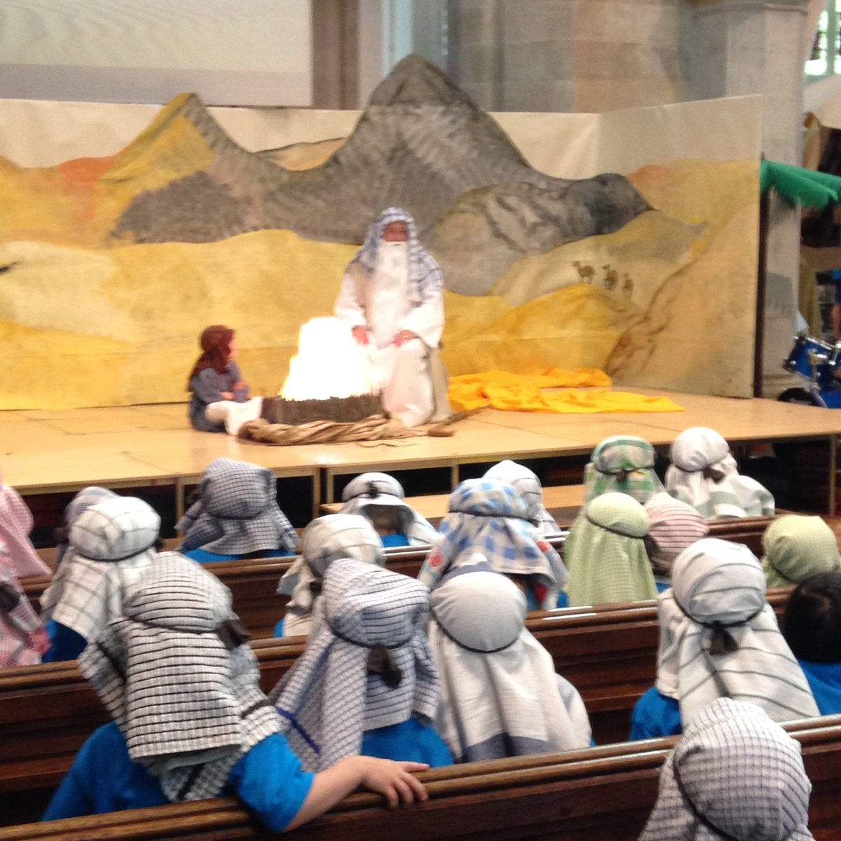 150 Holiday Club children hearing the story of Moses &amp; the Burning Bush.