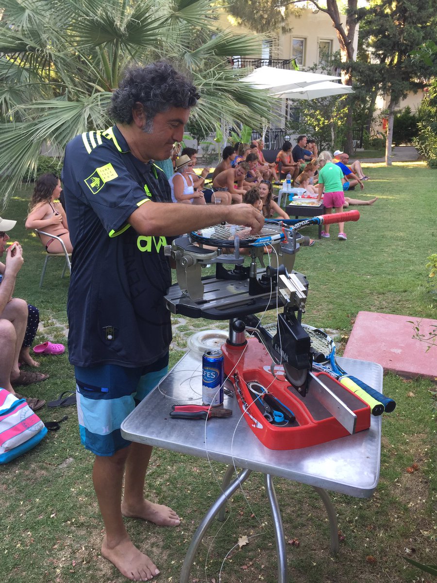 NeilsonSeaside's tweet photo. Tennis Tournament time, Sevki our GM restringing with the crowd enjoying the #tennis #seaside #turkey @_markpetchey https://t.co/tt8x9iVQnw