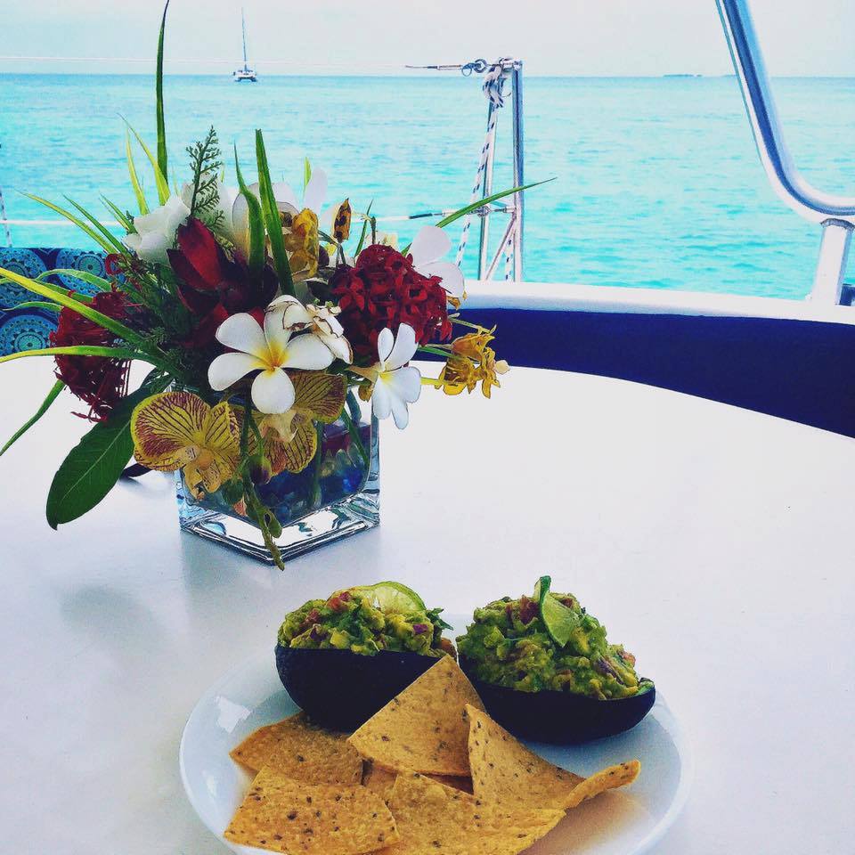 Dine on deck! Guacamole always tastes better on a boat, in Belize. Photo: Ellen Nicholas ow.ly/LbU9303df83