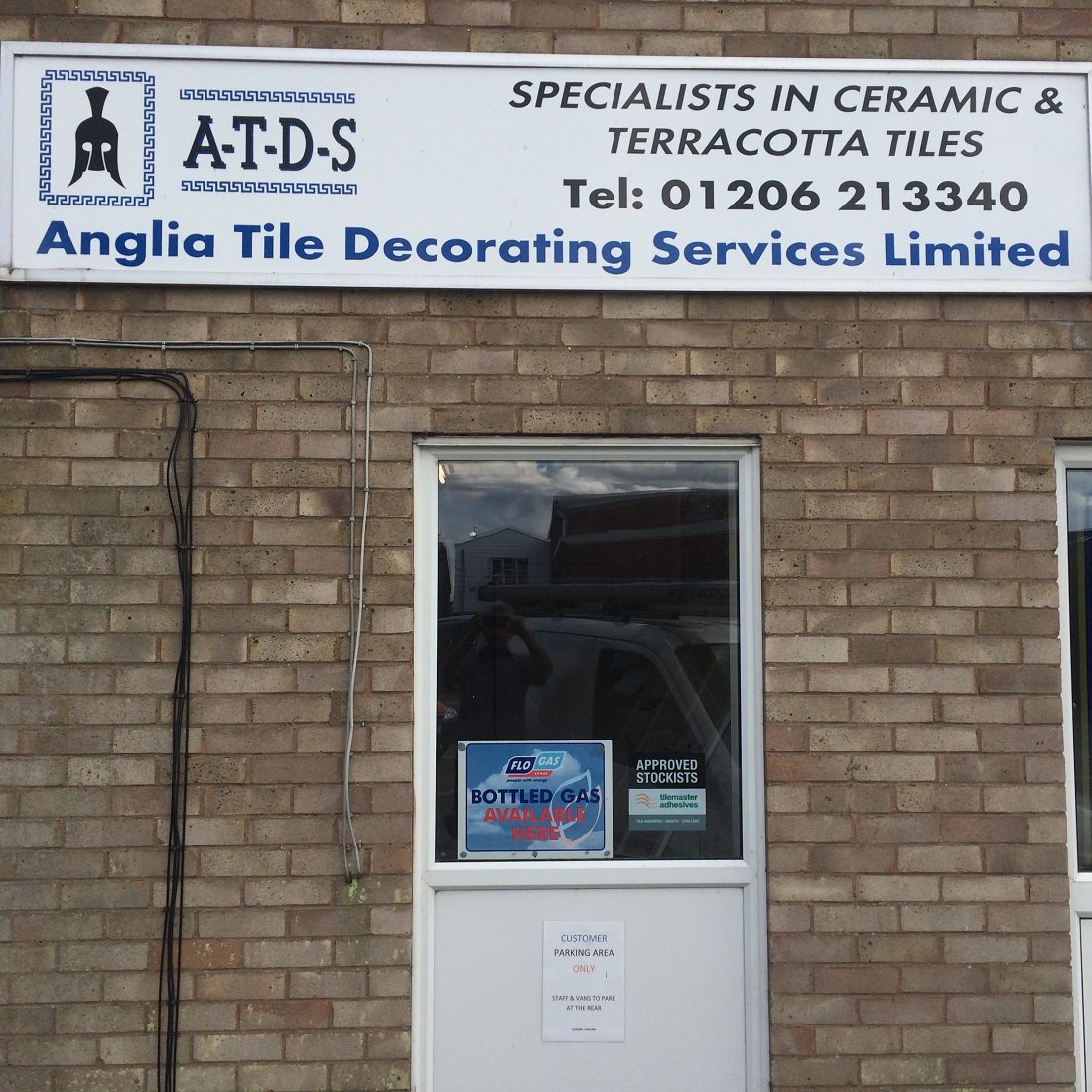 Tilemastersimon's tweet photo. Is that an Official Tilemaster Stockist window sticker ? I think it is at  ATDS in Copford near Colchester. https://t.co/1dcf5jmd13