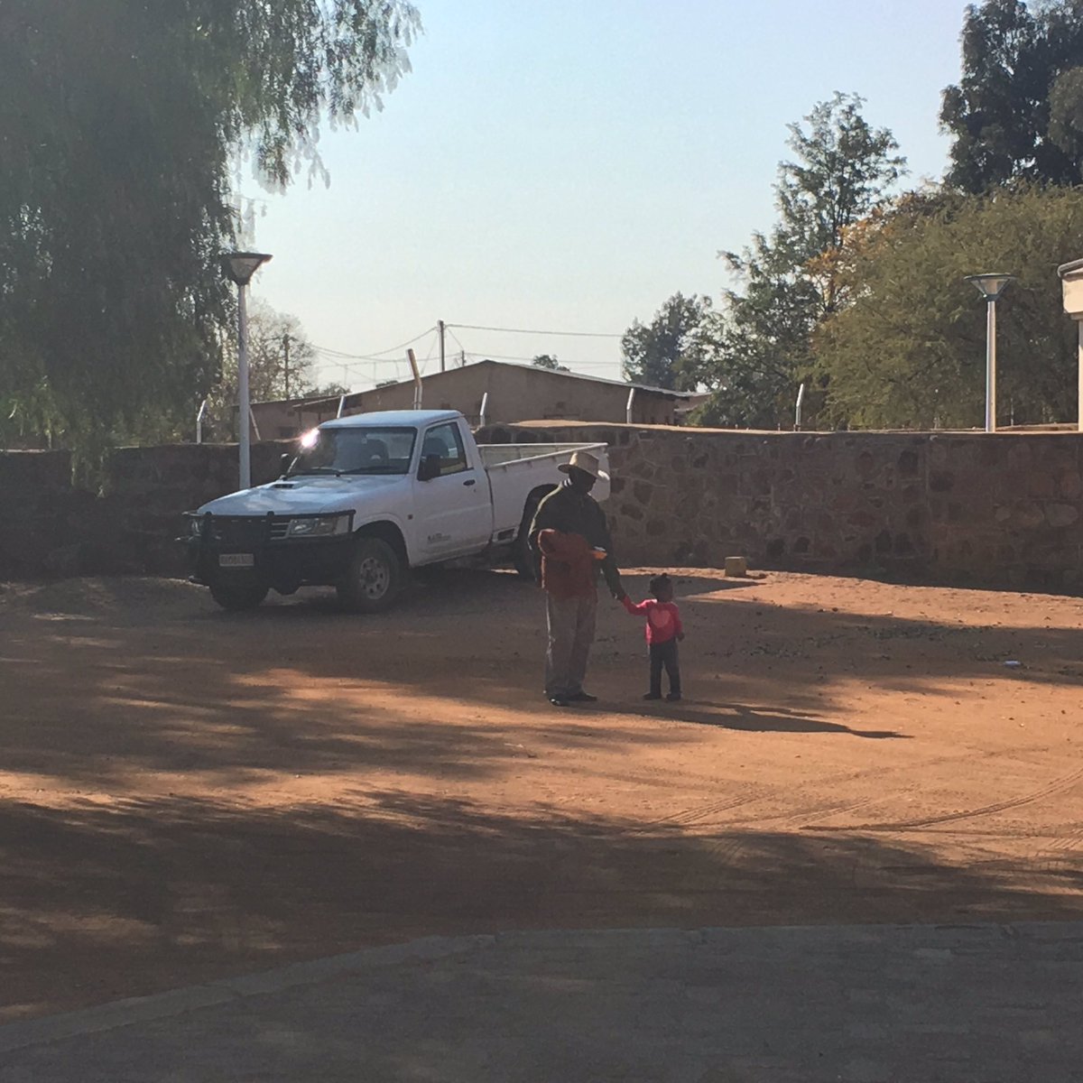 mbele_lnb's tweet photo. Grandad on babysitting duty, when men are a positive force for girls #Kanye village #Botswana at 50 #BBCworkinglives https://t.co/XqXHGwve6i