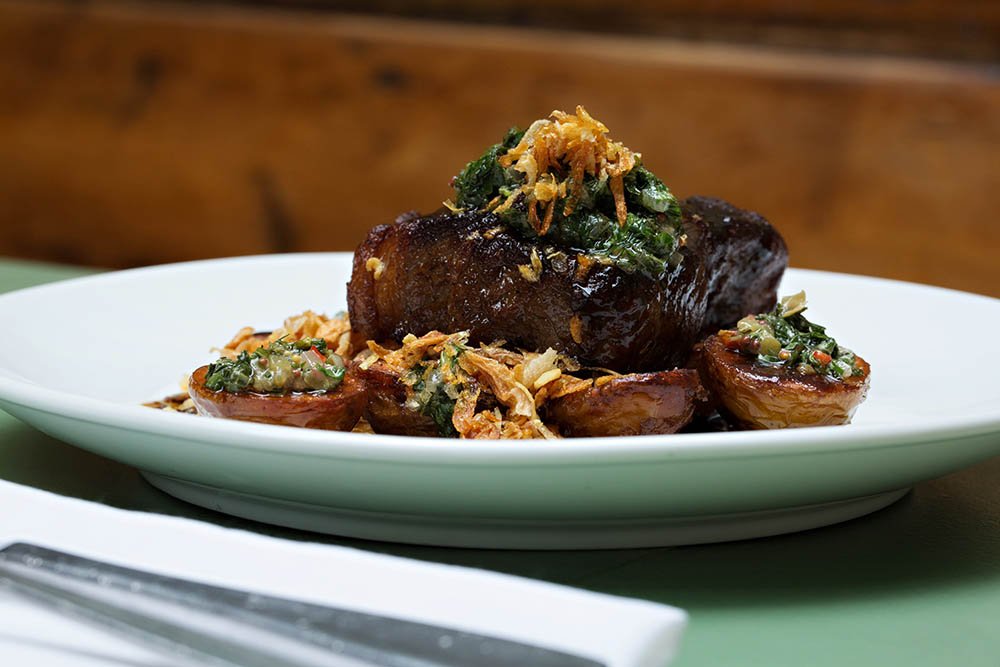 Feeling hungry? How about our naturally raised PEI beef striploin? Smoked mini potatoes, salsa verde and nori jus.